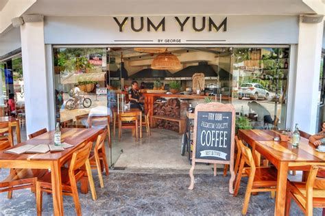 Yum yum cafe - Yum-Yum Café is a coffeehouse, bakery, bagelry and creamery open for breakfast and lunch. Cookies, muffins, biscuits, danish and pastries of all kinds are scratch-made by Ball. Lunch fare includes soup, mac and cheese, chicken pot pie and corndogs, to name a few.